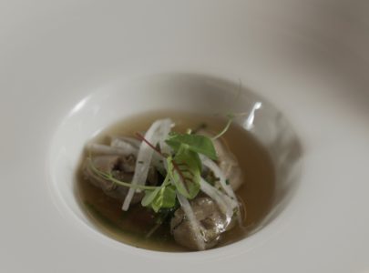 Belon oysters seared with glasswort, ham broth and tapioca marinated with Bonini condiment Affinato